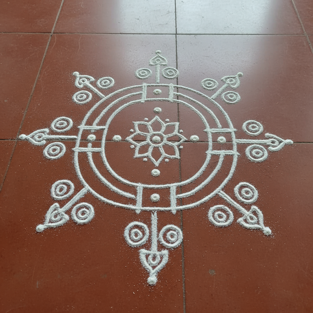 Simple Rice Flour White Kolam Rangoli on red tiles