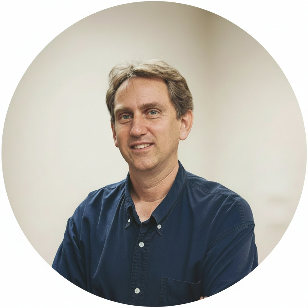 Circular headshot with solid white background outside the circle.