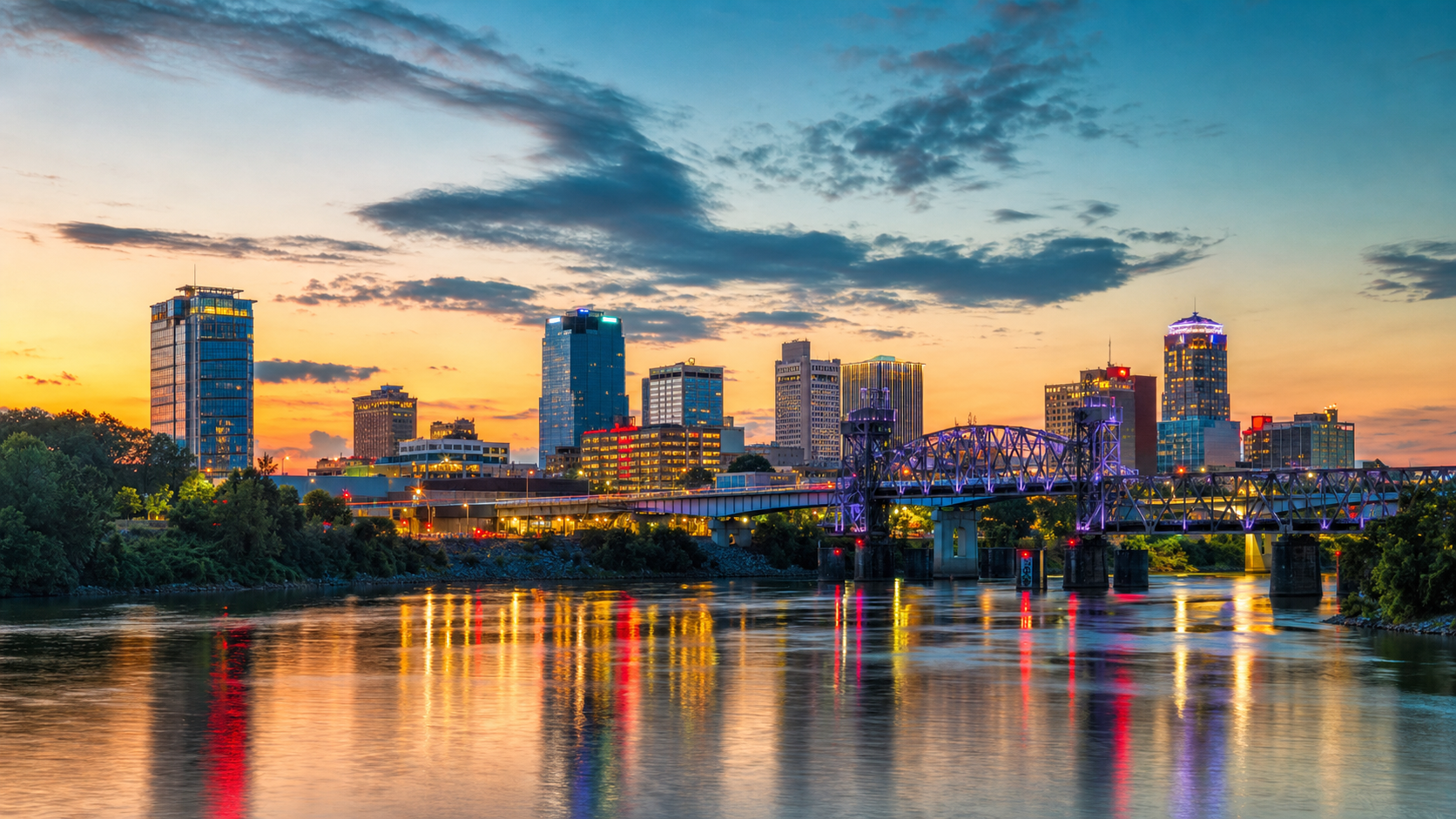Little Rock Arkansas skyline at dusk reflected in the Arkansas River
