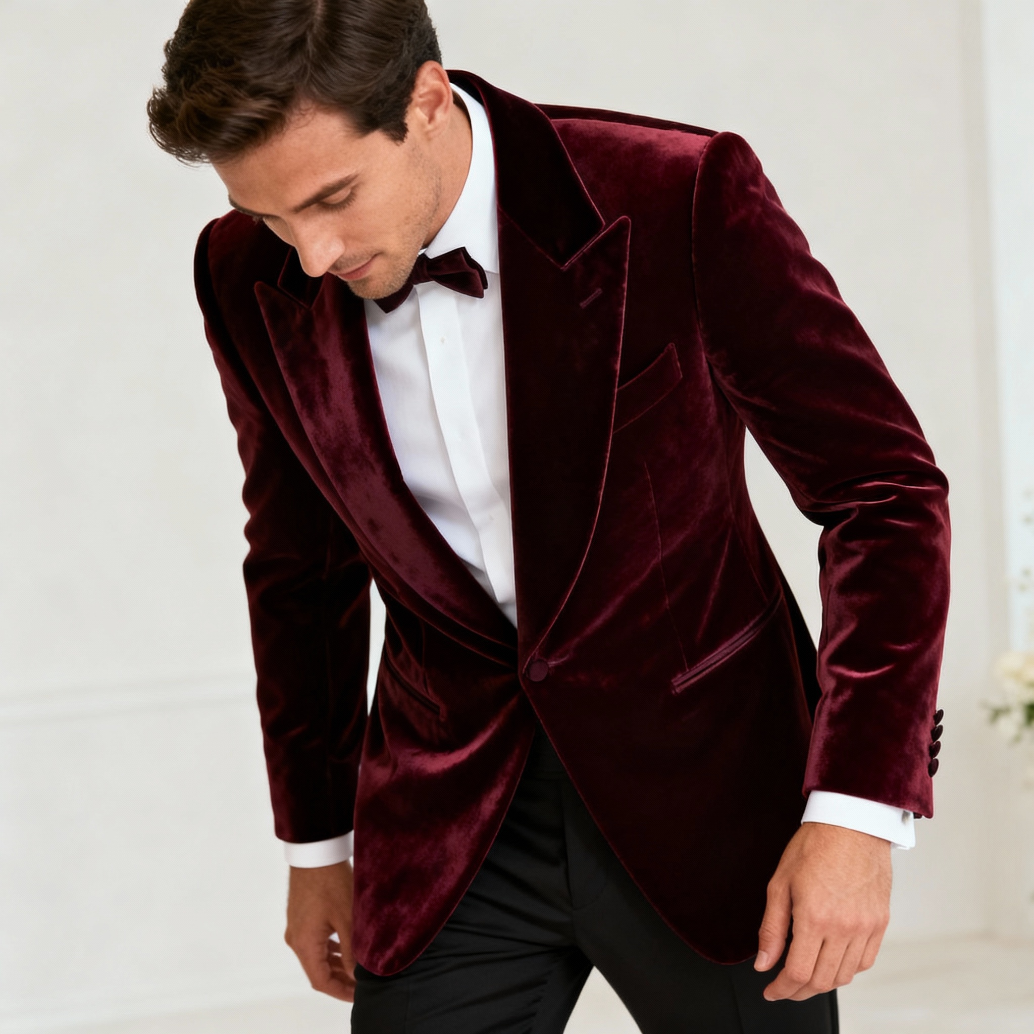 Groom in burgundy velvet tuxedo with shawl collar
