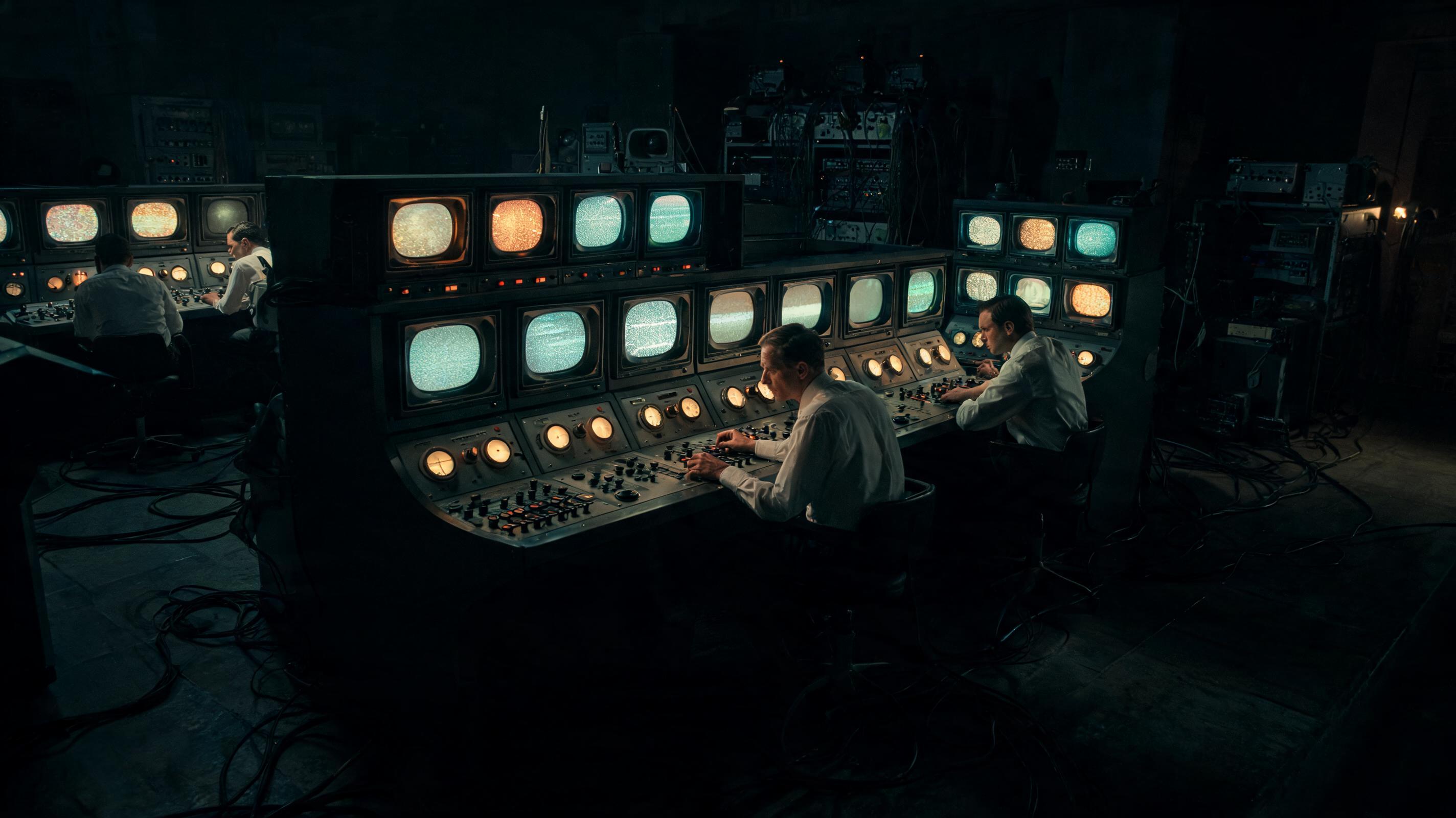 Vintage CBS broadcast control room with glowing monitors